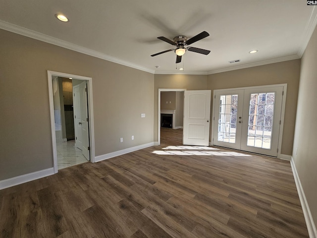 spare room featuring ceiling fan, french doors, dark hardwood / wood-style floors, and ornamental molding