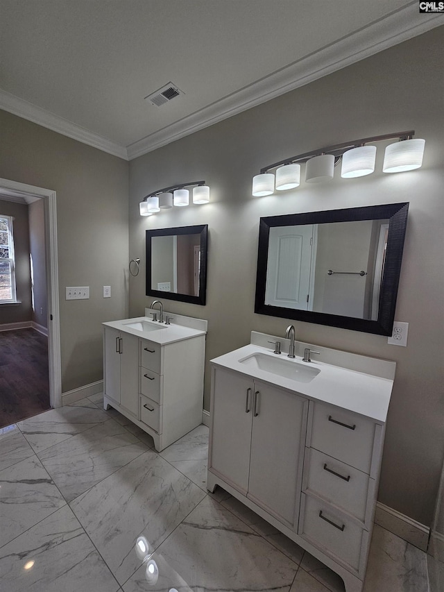 bathroom with vanity and ornamental molding