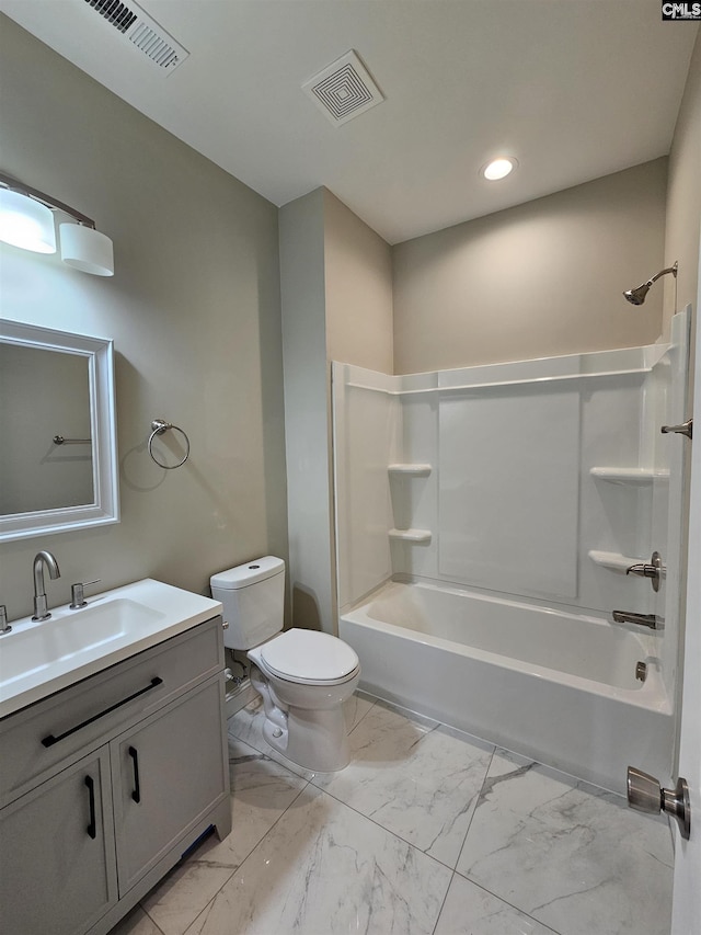 full bathroom featuring washtub / shower combination, vanity, and toilet