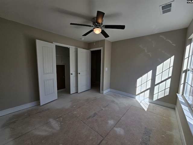 unfurnished bedroom with a closet and ceiling fan