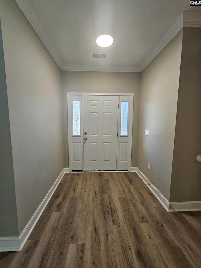 entrance foyer featuring crown molding and dark hardwood / wood-style flooring