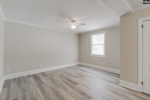 unfurnished room with ceiling fan, light wood-type flooring, and ornamental molding