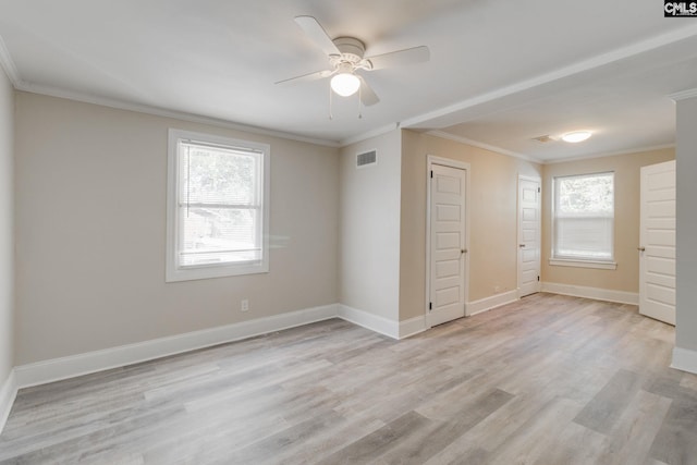 unfurnished bedroom featuring multiple windows, ceiling fan, crown molding, and light hardwood / wood-style flooring