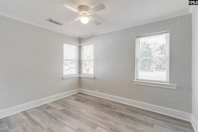 spare room with ceiling fan, crown molding, and light hardwood / wood-style flooring