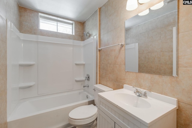 full bathroom featuring shower / bathtub combination, vanity, toilet, and tile walls