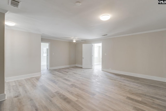 spare room featuring ceiling fan, ornamental molding, and light hardwood / wood-style flooring