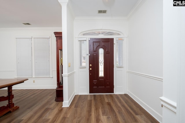 entryway with dark wood-type flooring and ornamental molding