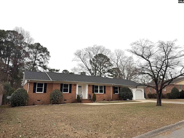 ranch-style home featuring a garage and a front lawn