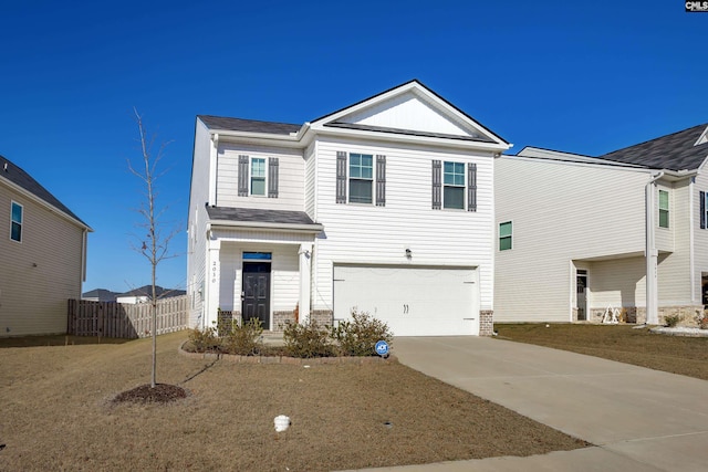 view of front of home with a garage and a front yard