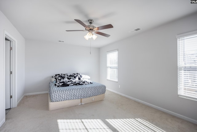 carpeted bedroom featuring ceiling fan