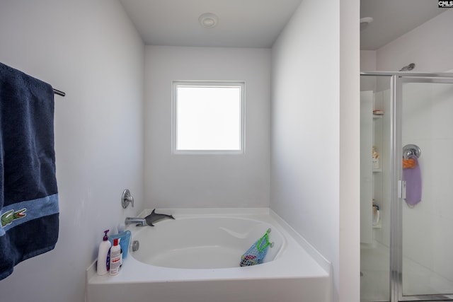 bathroom with shower with separate bathtub