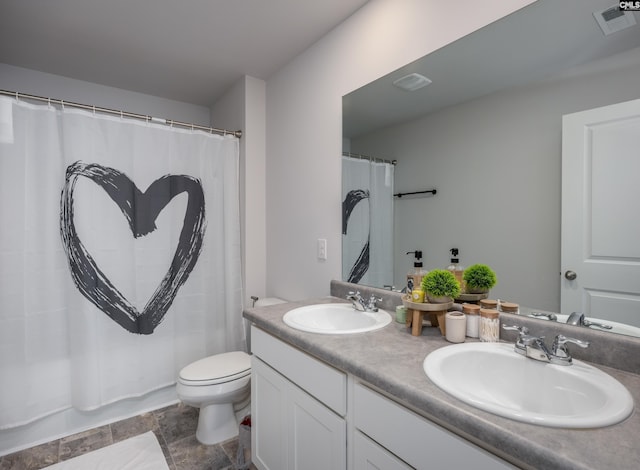 full bathroom featuring vanity, shower / bath combination with curtain, and toilet