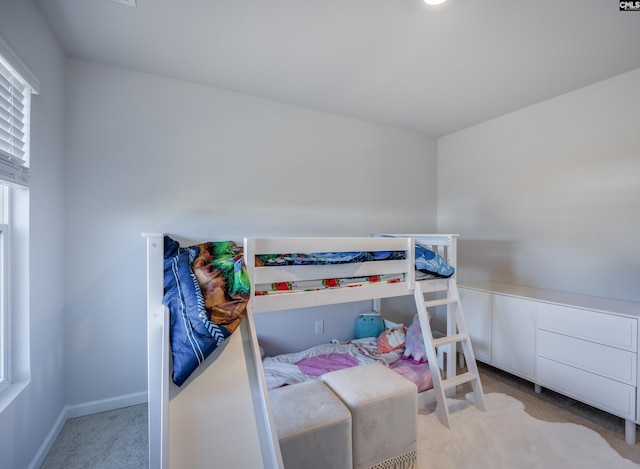 bedroom featuring light colored carpet