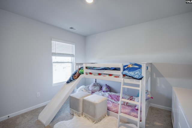 bedroom featuring light colored carpet