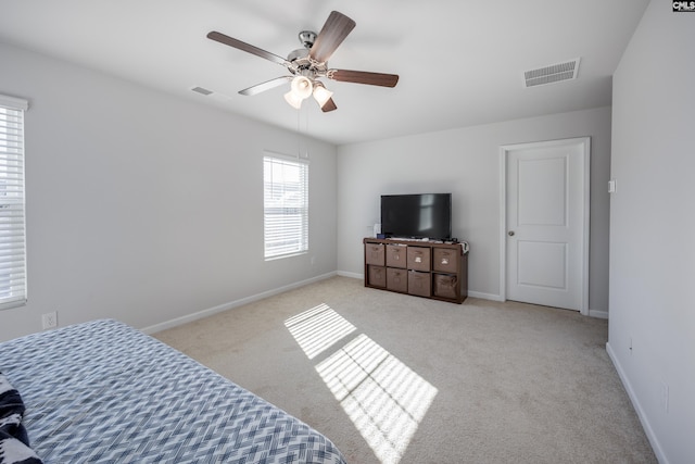 carpeted bedroom with ceiling fan