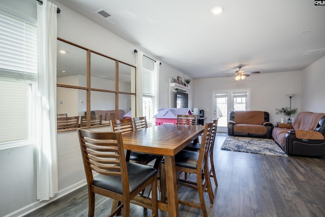 dining room featuring ceiling fan and dark wood-type flooring