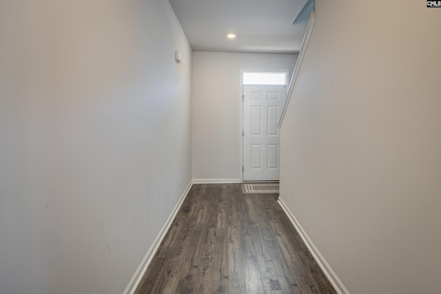 hallway with dark wood-type flooring