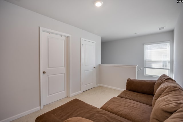 interior space featuring light carpet