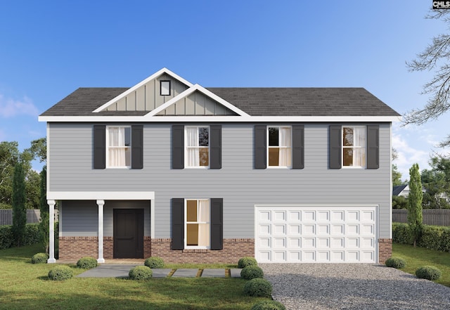 view of front of house with a garage and a front lawn