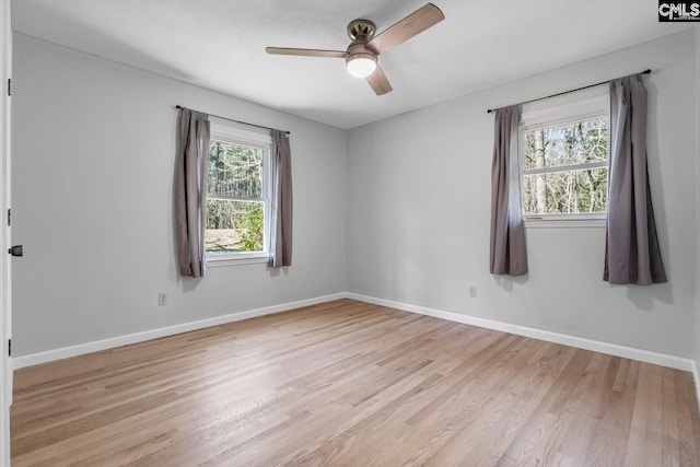 unfurnished room with ceiling fan and light hardwood / wood-style floors