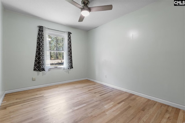 spare room with ceiling fan and light hardwood / wood-style flooring