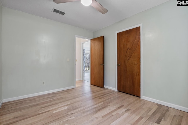 spare room featuring ceiling fan and light hardwood / wood-style flooring