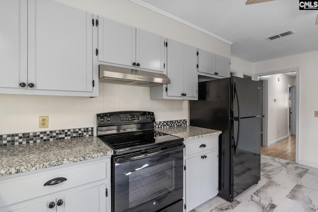 kitchen with black appliances and white cabinets