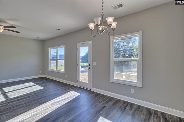 doorway to outside with dark wood finished floors, visible vents, ceiling fan with notable chandelier, and baseboards