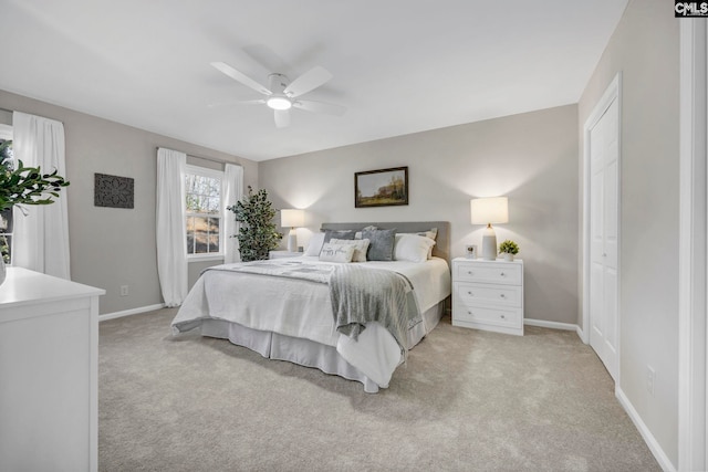 carpeted bedroom with ceiling fan