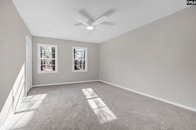 spare room featuring ceiling fan and light colored carpet