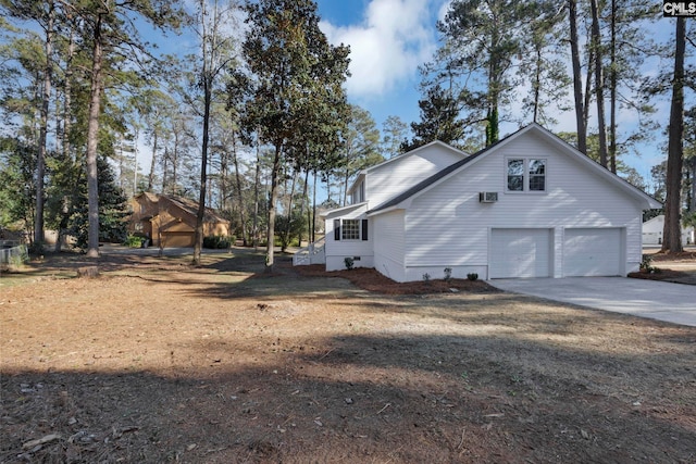 view of side of home featuring a garage