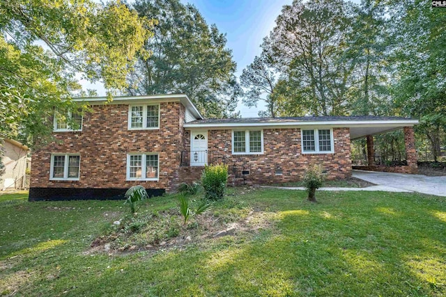 tri-level home featuring a front yard and a carport