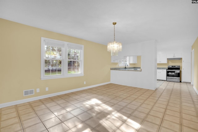 interior space with a notable chandelier and sink