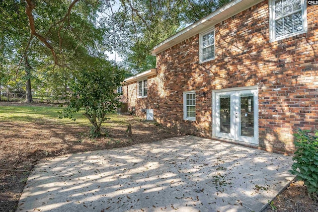 back of house featuring a patio area and french doors