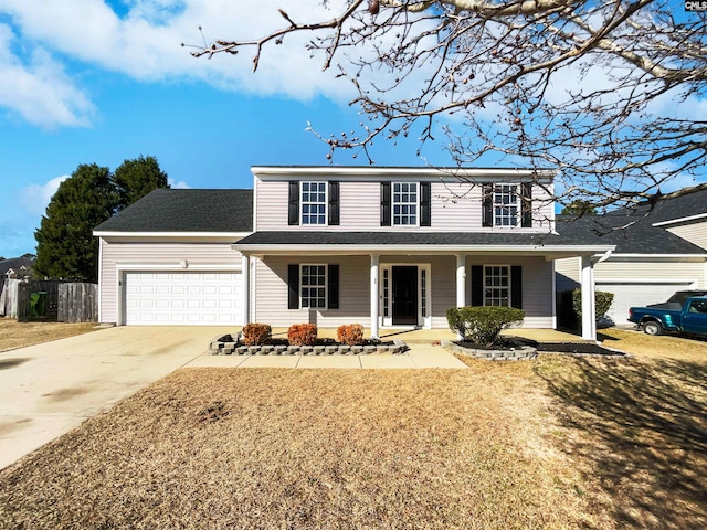 view of front of home featuring covered porch and a garage