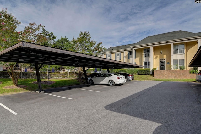 view of parking / parking lot with a carport