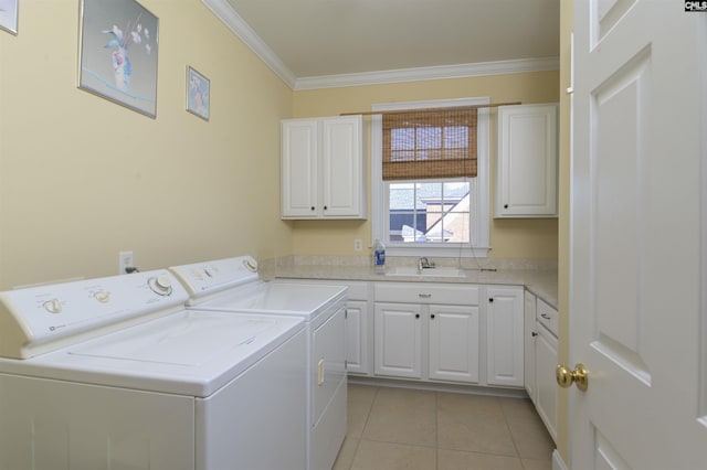 washroom featuring cabinets, washer and clothes dryer, crown molding, sink, and light tile patterned flooring