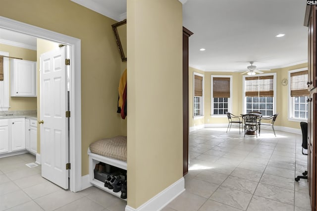 mudroom featuring light tile patterned floors, ceiling fan, and crown molding