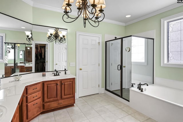 bathroom with a notable chandelier, separate shower and tub, tile patterned floors, vanity, and ornamental molding