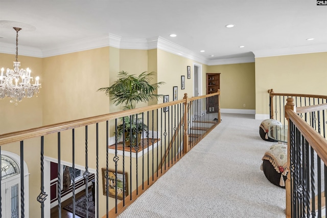 corridor featuring crown molding, carpet, and a notable chandelier