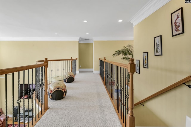 corridor with crown molding and light colored carpet