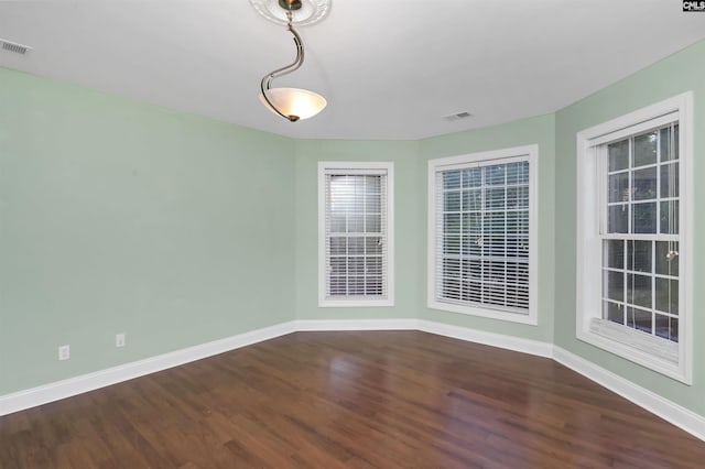 unfurnished room featuring hardwood / wood-style floors