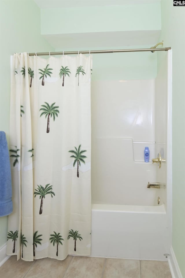 bathroom with tile patterned flooring and shower / bathtub combination with curtain