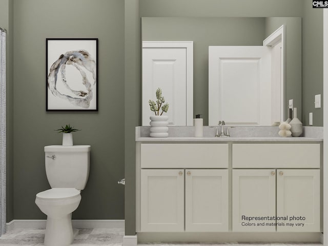 bathroom with vanity and toilet