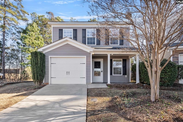 view of front of home featuring a porch and a garage