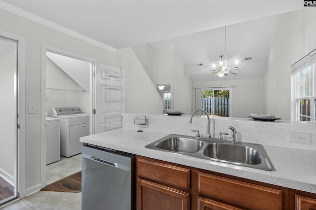 kitchen with stainless steel dishwasher, a wealth of natural light, sink, and hanging light fixtures