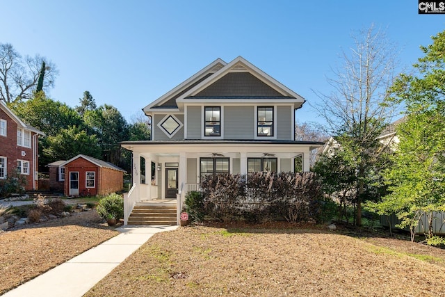 view of front of property with covered porch and an outdoor structure