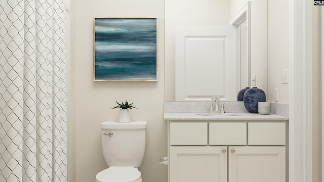 bathroom featuring a shower with shower curtain, vanity, and toilet