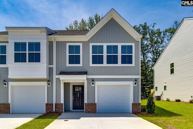 view of front of house with a front lawn, cooling unit, and a garage