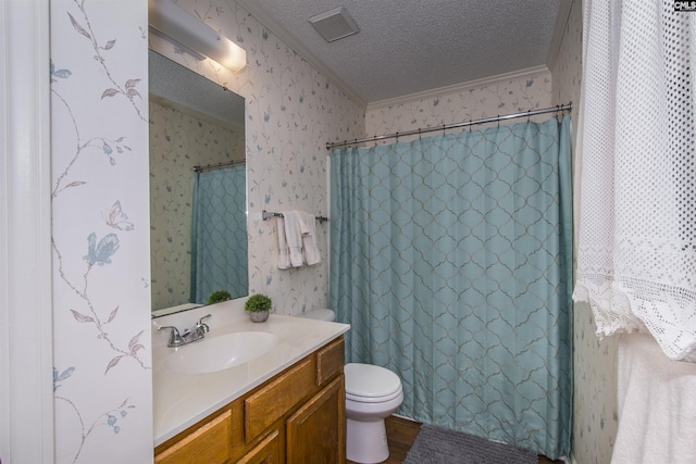 bathroom featuring ornamental molding, vanity, a textured ceiling, wood-type flooring, and toilet